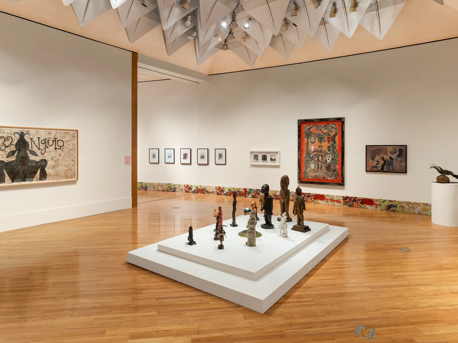 Interior view of Frost Art Museum gallery with various artworks and sculptures from the permanent collection